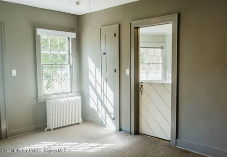 a view of a room that has a window in it