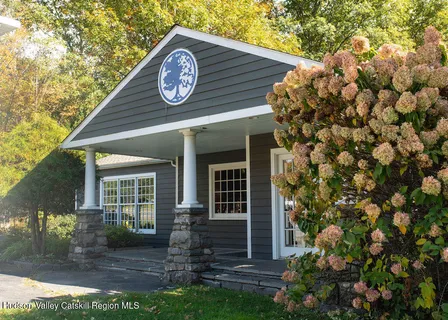 a view of house with backyard
