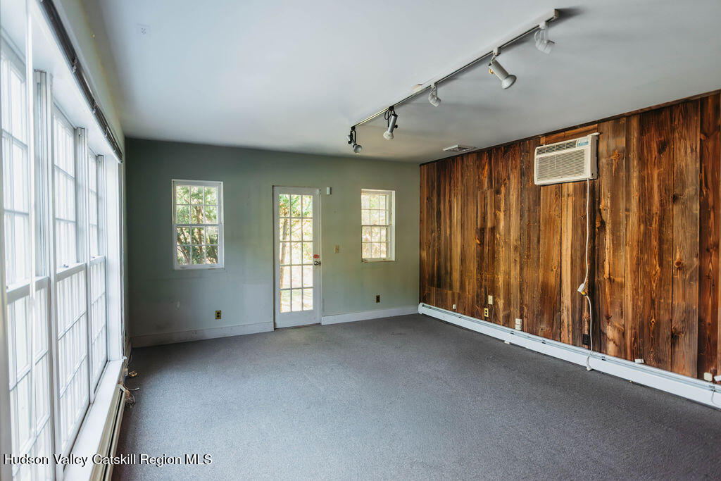 3927 Main Street Stone Ridge, NY 12484 - Photo 27 of 32 a view of an empty room with a window and bathroom with windows