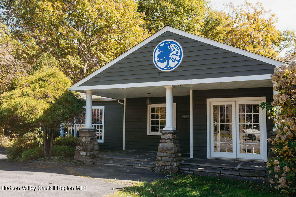 3927 Main Street Stone Ridge, NY 12484 - Photo 31 of 32 a view of a house with a small yard and large tree
