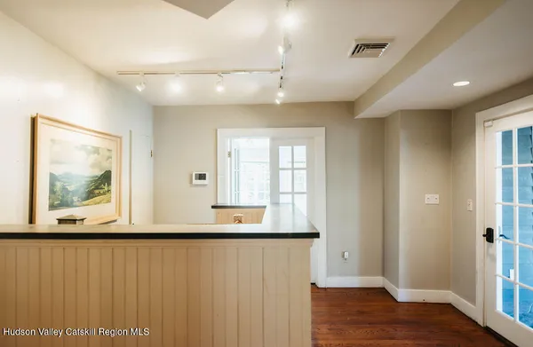 a view of an entryway with wooden floor