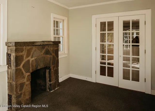 a view of empty room with windows