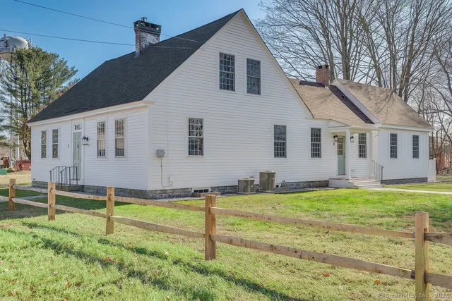 a house that has a big yard in front of it