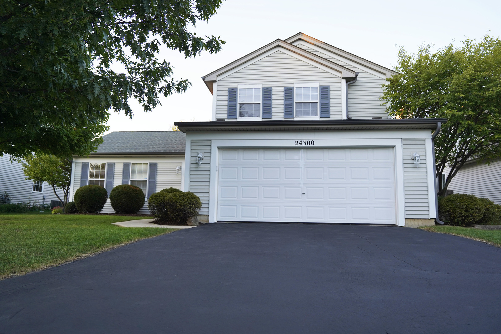 24300 White Oak Drive Plainfield, IL 60585 - Photo 1 of 32 a front view of a house with a yard and garage