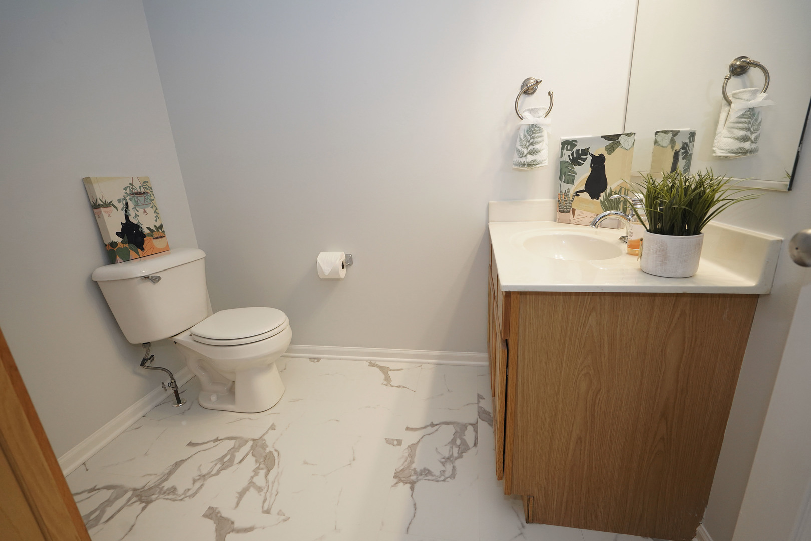 24300 White Oak Drive Plainfield, IL 60585 - Photo 18 of 32 a bathroom with a sink a toilet and mirror