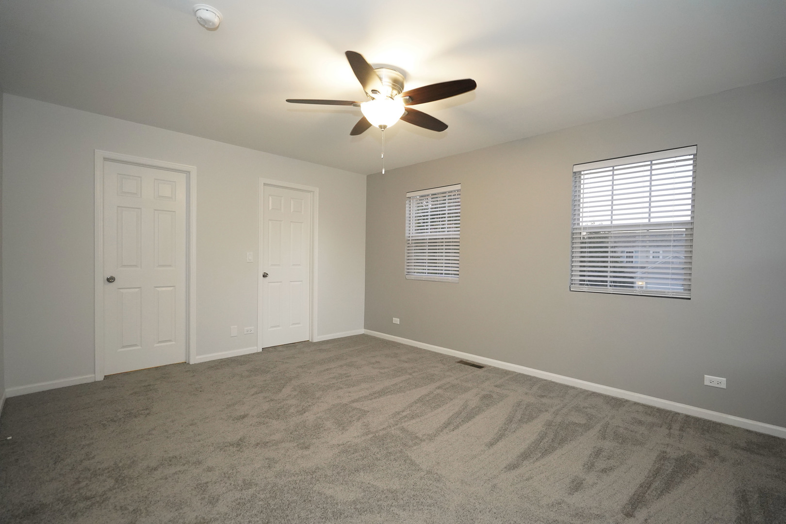 24300 White Oak Drive Plainfield, IL 60585 - Photo 21 of 32 a view of an empty room with a ceiling fan