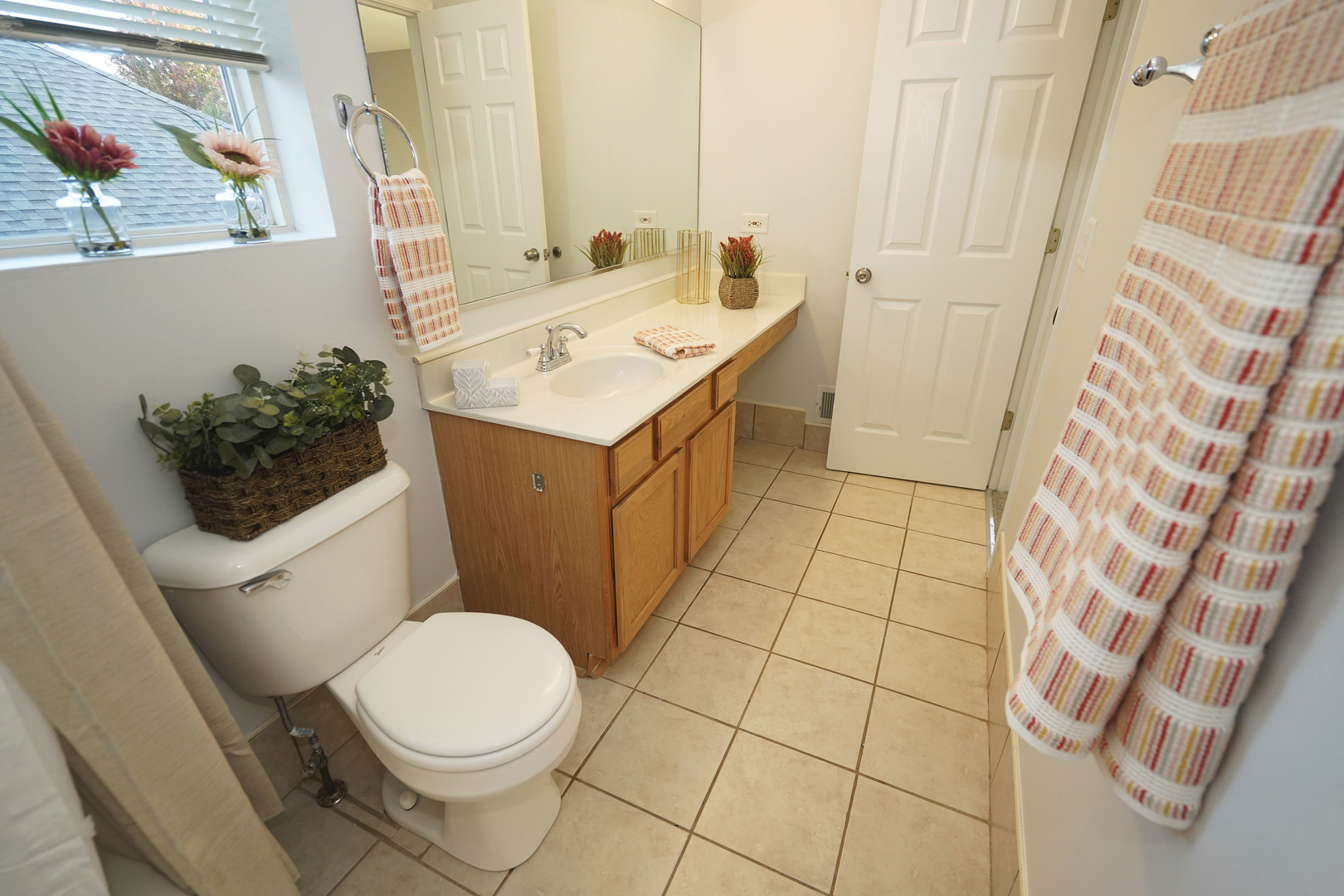 24300 White Oak Drive Plainfield, IL 60585 - Photo 23 of 32 a bathroom with a sink a toilet and a mirror