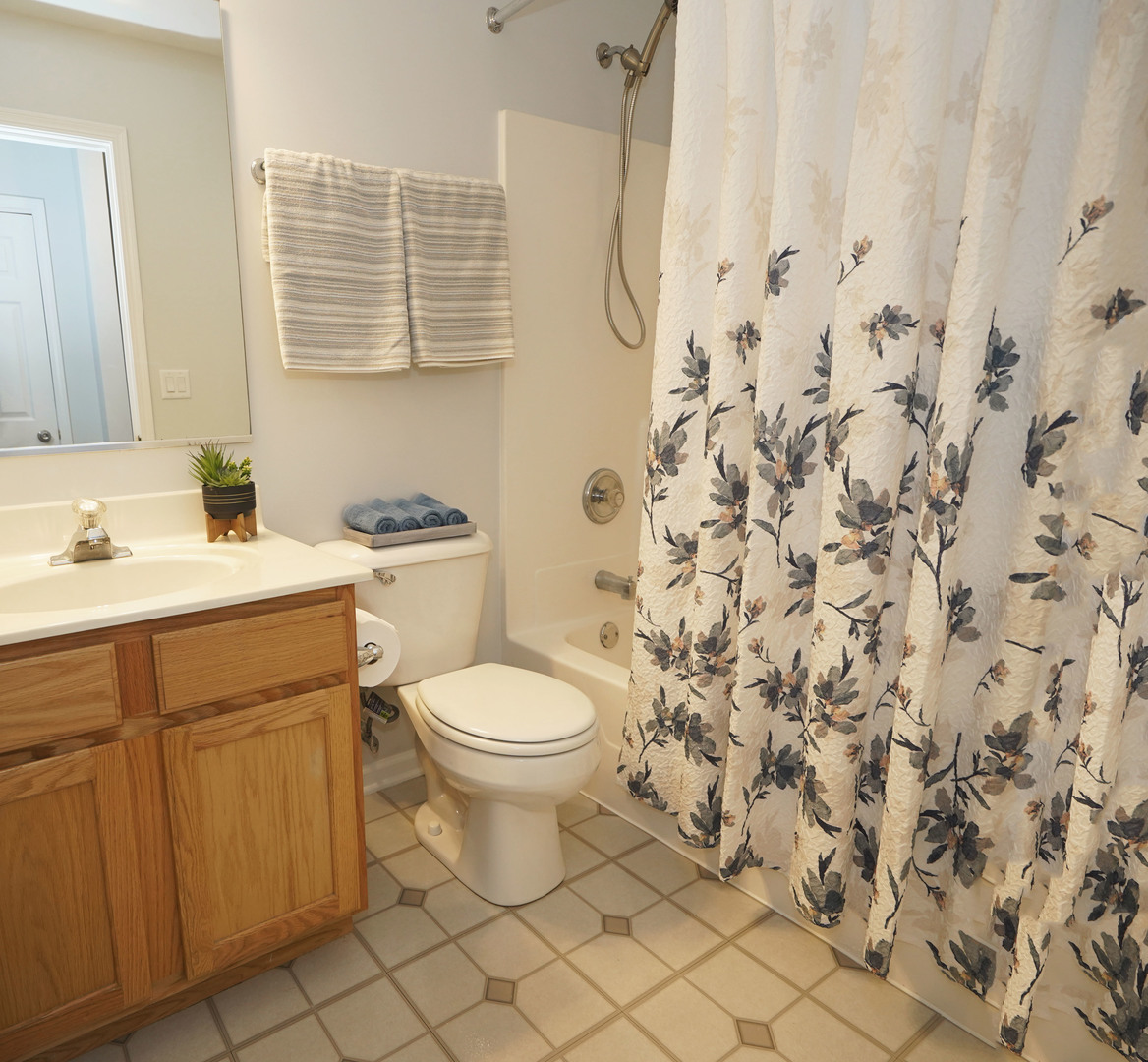 24300 White Oak Drive Plainfield, IL 60585 - Photo 28 of 32 a bathroom with a sink a toilet and a window