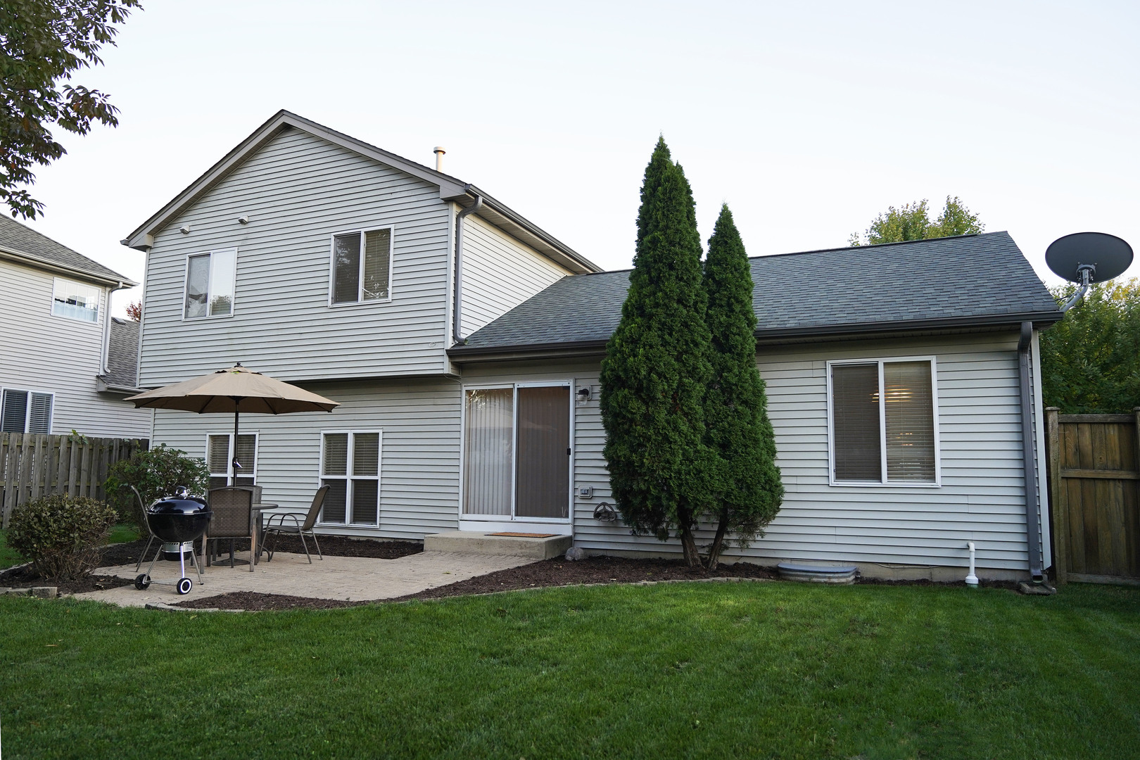 24300 White Oak Drive Plainfield, IL 60585 - Photo 31 of 32 a front view of a house with a yard and outdoor seating