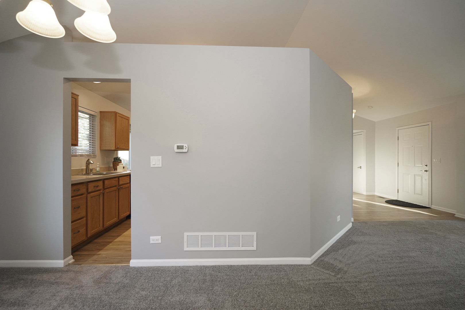 24300 White Oak Drive Plainfield, IL 60585 - Photo 7 of 32 a view of a hallway with wooden floor