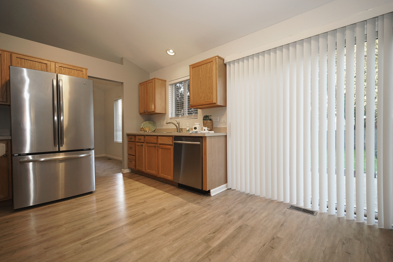 24300 White Oak Drive Plainfield, IL 60585 - Photo 9 of 32 a kitchen with stainless steel appliances granite countertop a refrigerator a sink a stove and oven