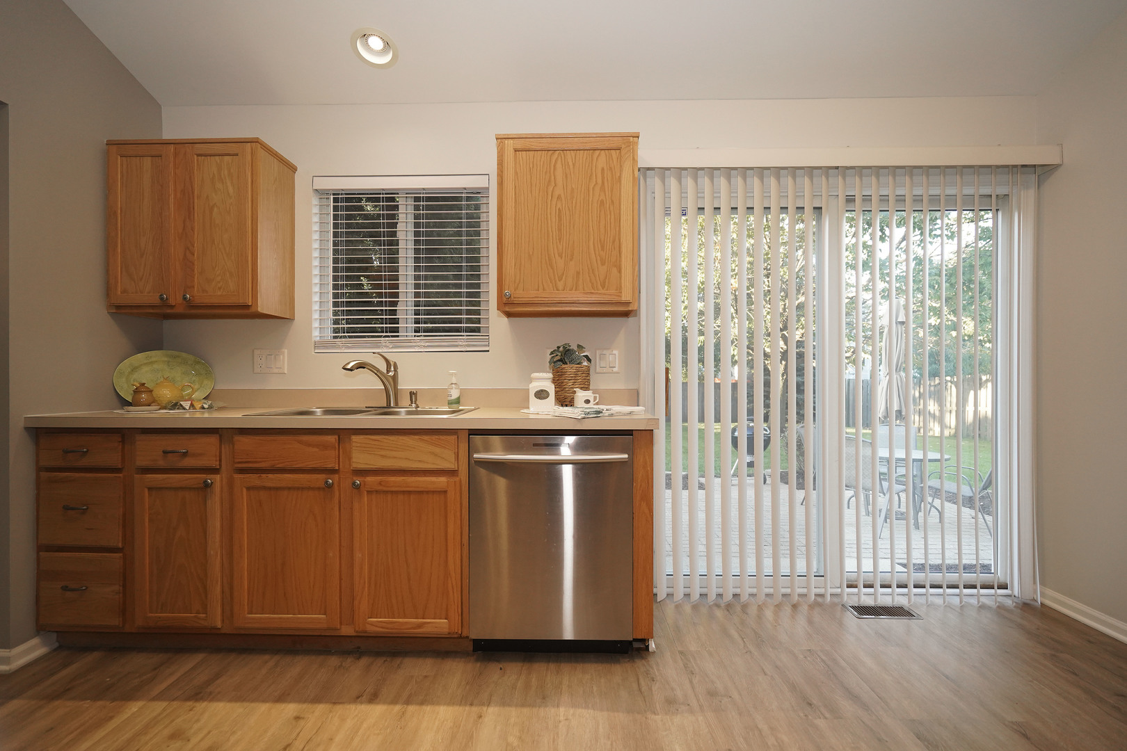 24300 White Oak Drive Plainfield, IL 60585 - Photo 10 of 32 a kitchen with stainless steel appliances granite countertop a sink a stove a refrigerator and cabinets