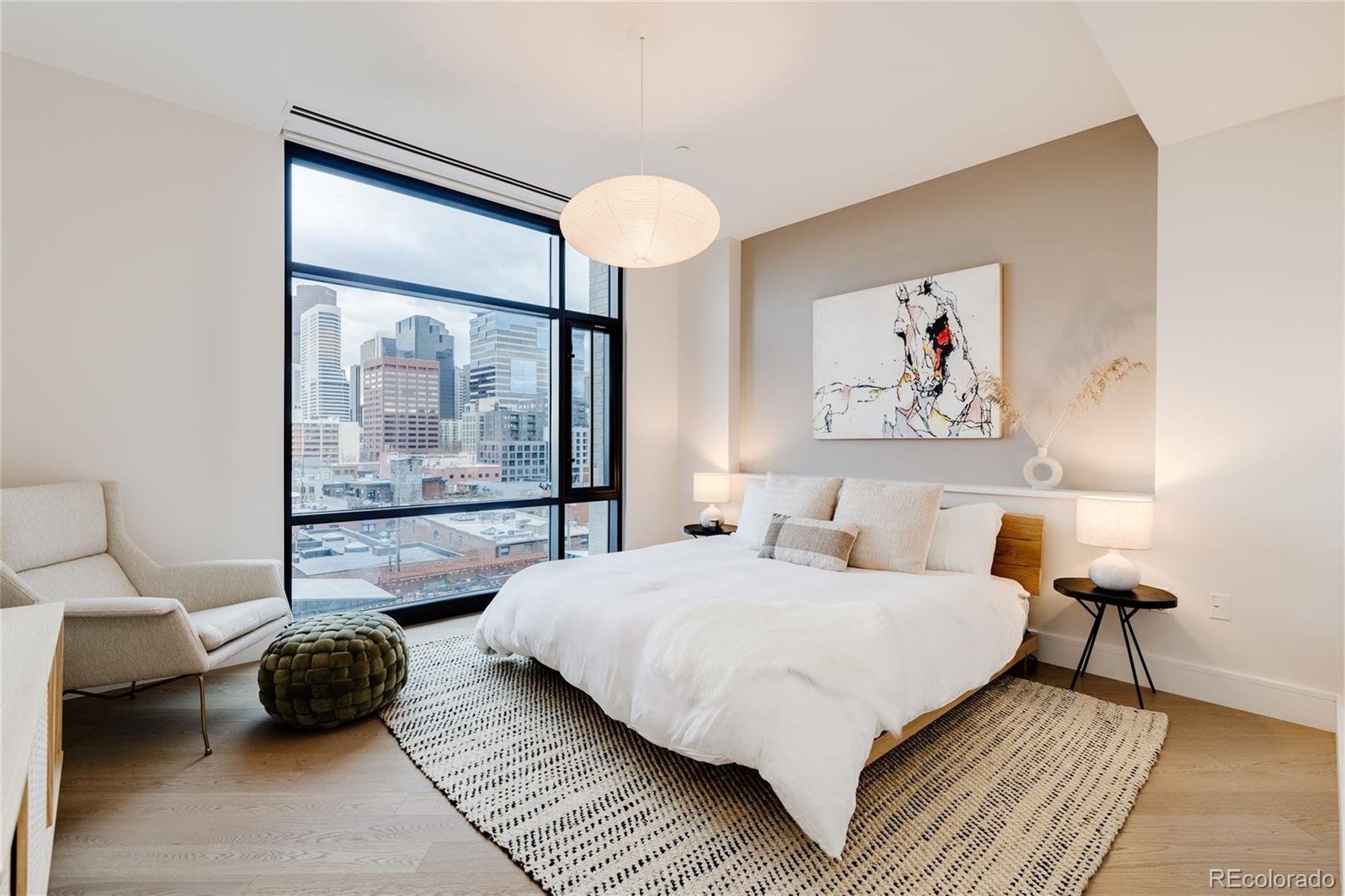 1901 Wazee Street, Unit 720 Denver, CO 80202 - Photo 3 of 40 a bedroom with a bed a couch and a window