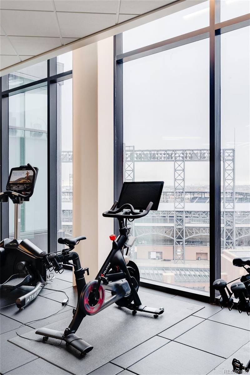 1901 Wazee Street, Unit 720 Denver, CO 80202 - Photo 34 of 40 a room with gym equipment and a large window
