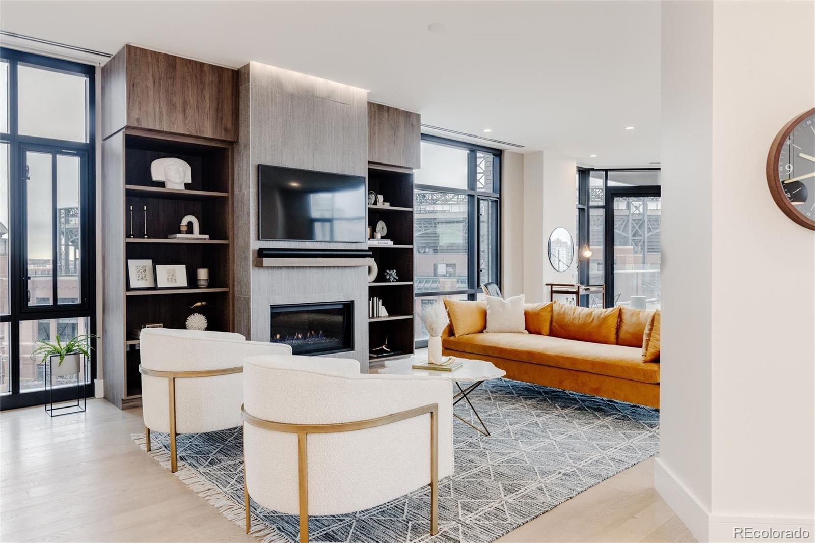 1901 Wazee Street, Unit 720 Denver, CO 80202 - Photo 8 of 40 a living room with furniture a fireplace and a large window
