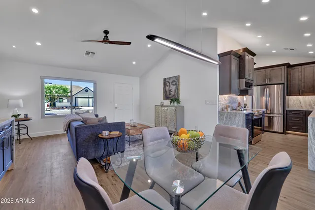 a kitchen with kitchen island granite countertop wooden cabinets a sink and dishwasher
