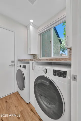 a bathroom with a granite countertop sink a toilet and a bathtub