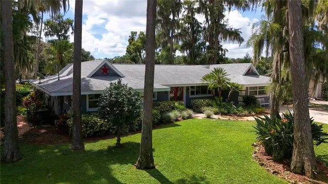 a living room with furniture lamp and window