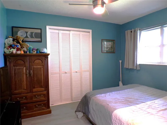 a view of a swimming pool with an outdoor space and seating area