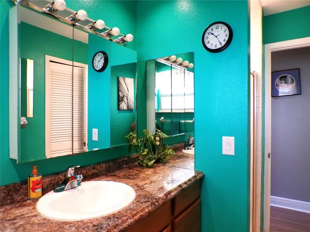 an aerial view of a house with a yard basket ball court and outdoor seating