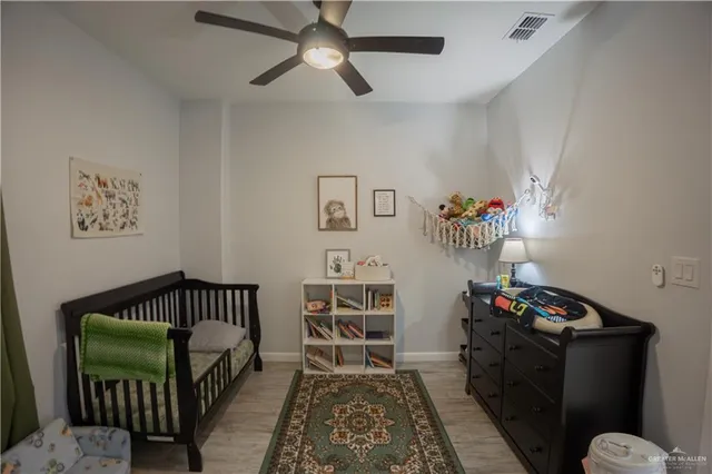 a bedroom with furniture and a chandelier