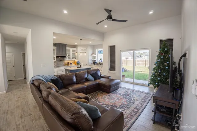 a living room with furniture and a large window
