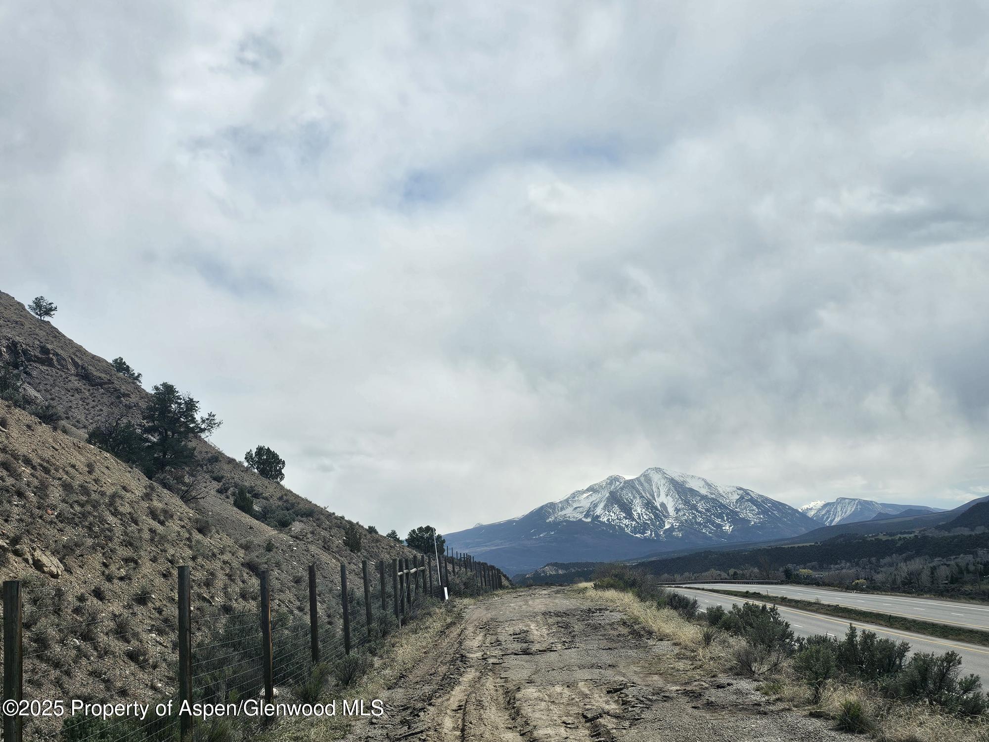 82 Highway 82 Carbondale, CO 81623 - Photo 1 of 6 a view of a dry yard with mountains in the background
