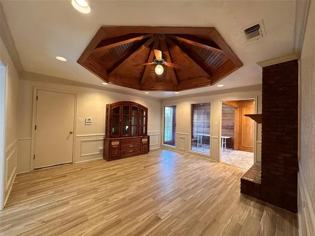 a view of a livingroom with wooden floor