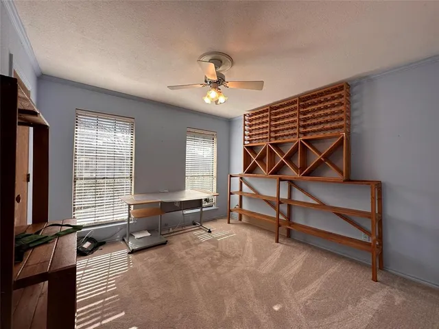 a bedroom with furniture and window