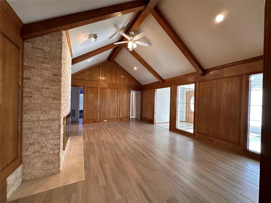 1030 Clinton Street Carrollton, TX 75007 - Photo 9 of 33 a view of empty room with wooden floor and fan