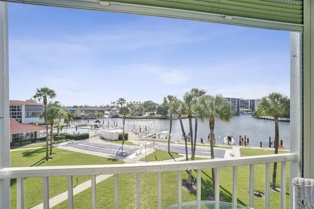 a view of a swimming pool with an outdoor seating