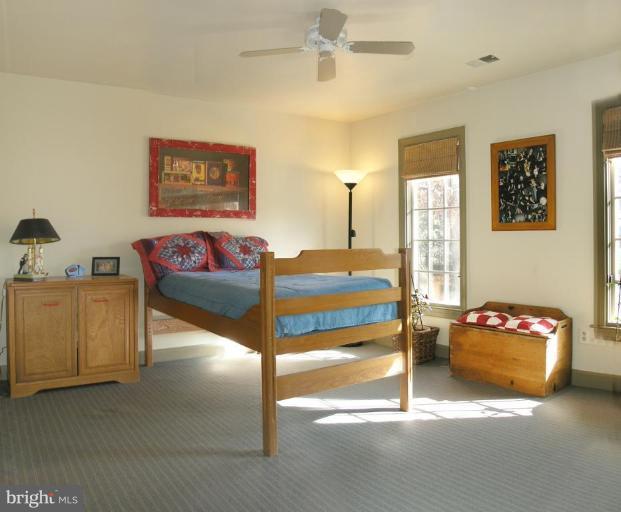 1300 Stamford Way Reston, VA 20194 - Photo 17 of 30 a bedroom with furniture and a couch