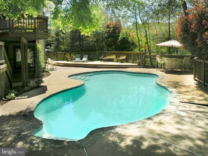 1300 Stamford Way Reston, VA 20194 - Photo 3 of 30 a view of a swimming pool with a patio