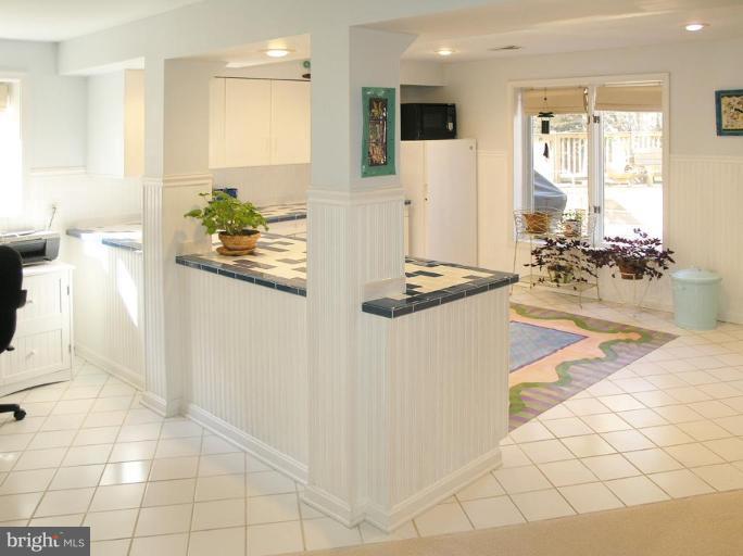 1300 Stamford Way Reston, VA 20194 - Photo 21 of 30 a view of kitchen with stainless steel appliances kitchen island granite countertop a refrigerator and a stove