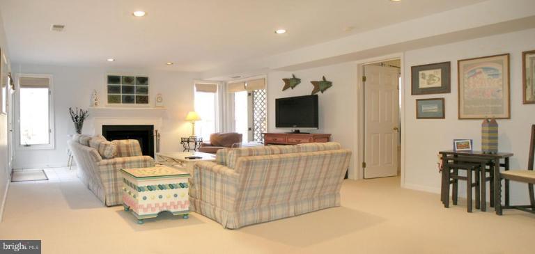 1300 Stamford Way Reston, VA 20194 - Photo 23 of 30 a living room with furniture and a flat screen tv