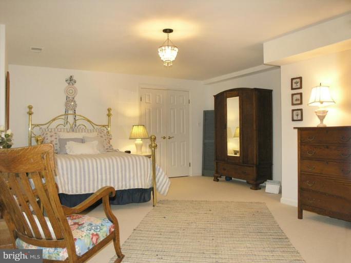 1300 Stamford Way Reston, VA 20194 - Photo 24 of 30 a view of a bedroom with furniture