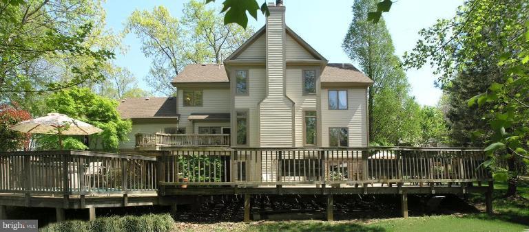 1300 Stamford Way Reston, VA 20194 - Photo 4 of 30 a front view of a house with a yard