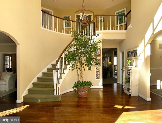 1300 Stamford Way Reston, VA 20194 - Photo 5 of 30 a view of entryway and hall with wooden floor