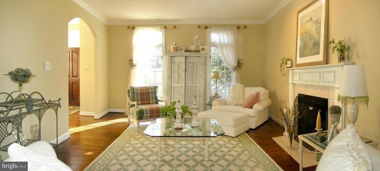 1300 Stamford Way Reston, VA 20194 - Photo 6 of 30 a living room with fireplace furniture and a chandelier