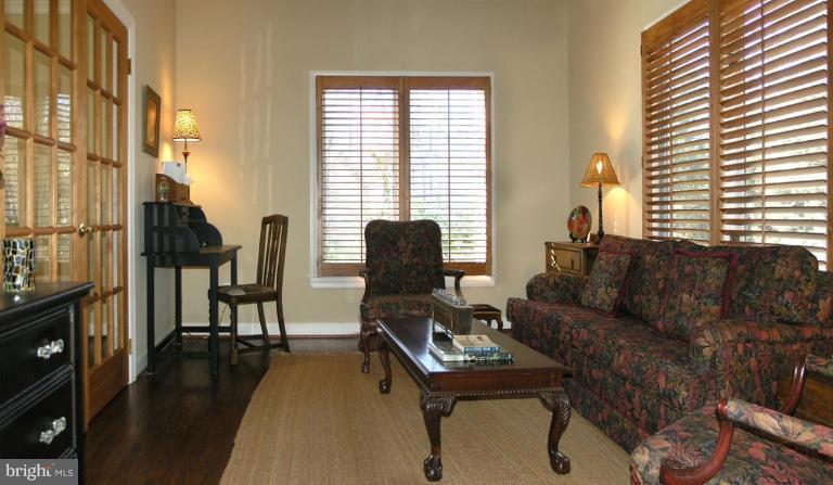 1300 Stamford Way Reston, VA 20194 - Photo 8 of 30 a living room with furniture and a wooden floor