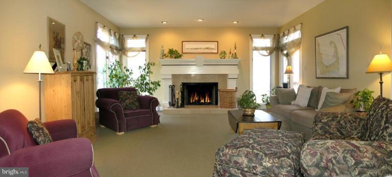 1300 Stamford Way Reston, VA 20194 - Photo 9 of 30 a living room with furniture and a fireplace