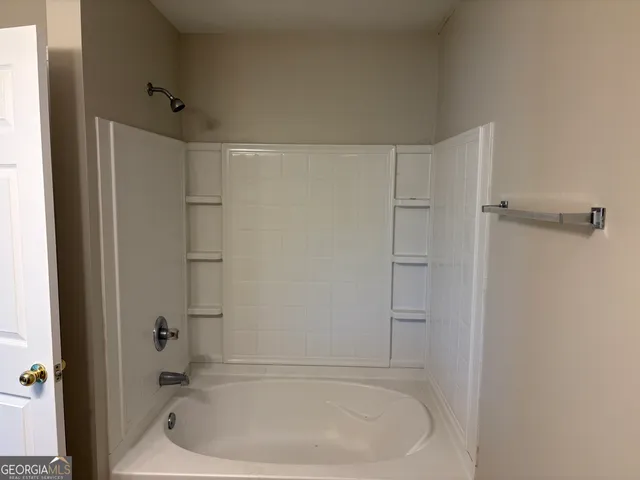 a bathroom with a bathtub