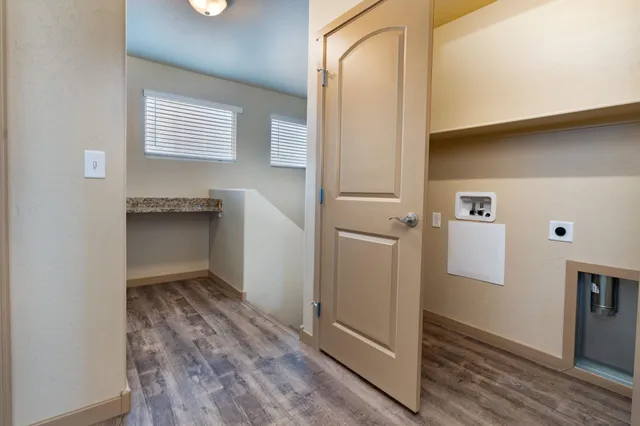 a view of a kitchen from a hallway