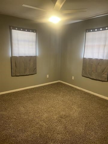 775 West Herring Street Sour Lake, TX 77659 - Photo 12 of 21 a view of an empty room with wooden floor and a window