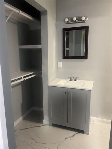 775 West Herring Street Sour Lake, TX 77659 - Photo 17 of 21 a bathroom with a sink vanity and mirror