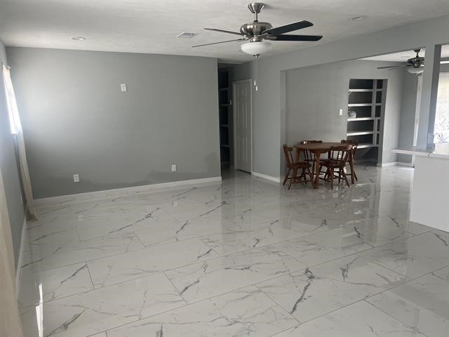 775 West Herring Street Sour Lake, TX 77659 - Photo 19 of 21 an empty room with windows and fan