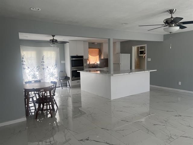 775 West Herring Street Sour Lake, TX 77659 - Photo 21 of 21 a view of a livingroom with furniture window and wooden floor