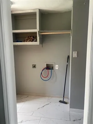 a kitchen with cabinets appliances and a window