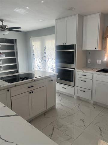 775 West Herring Street Sour Lake, TX 77659 - Photo 4 of 21 a kitchen with cabinets appliances and a window