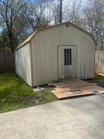 a view of a backyard with a garden